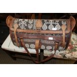 A PART LEATHER AND WOVEN ETHNIC DESIGN HOLDALL