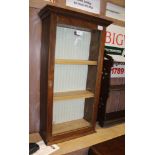 A SCRATCH BUILT WOODEN FRAMED WALL MOUNTABLE DISPLAY CABINET with plain glazed door