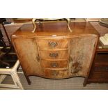 A WELL MADE MAHOGANY FINISHED SERPENTINE FRONTED SIDEBOARD having four central bowed drawers,