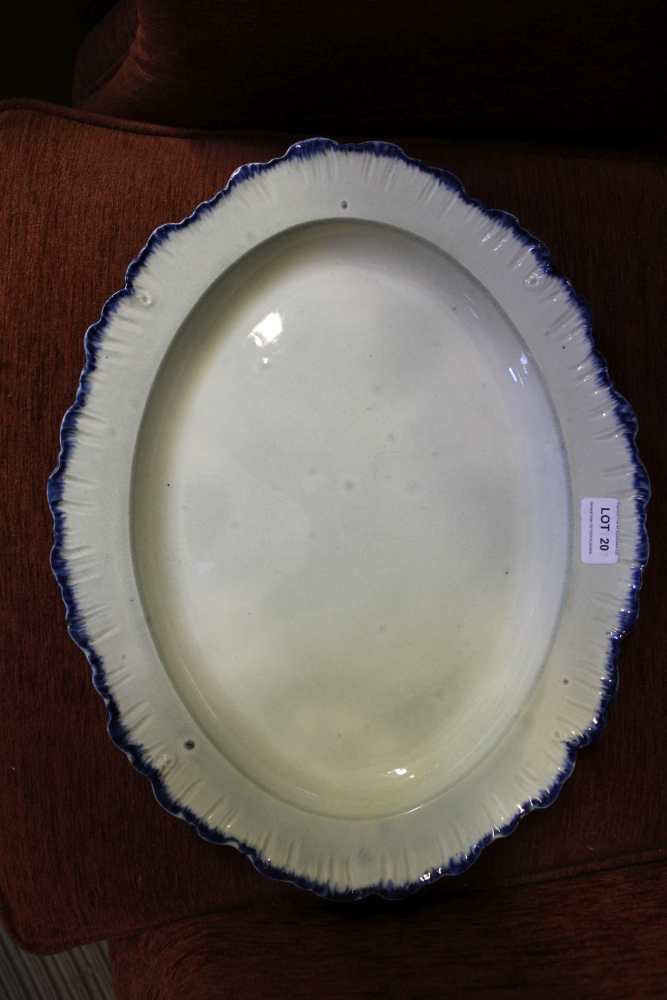 AN EARLY ENGLISH PEARLWARE MEAT DISH, of oval form with blue shell or feather edge, impressed mark