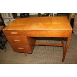 A TEAK FINISHED RETRO DESIGN DRESSING TABLE, with lift up mirror lid, flanked by three plain drawers