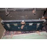 A HARDSHELL TRAVELLING TRUNK