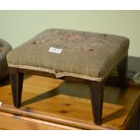 A SMALL WOODEN FRAMED FOUR LEGGED STOOL with wool work pad top