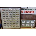 A GLAZED AND FRAMED SET OF FIFTY CIGARETTE CARDS depicting vintage vehicles various, together with a