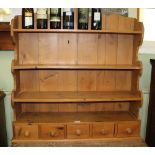 A PINE WALL MOUNTABLE SET OF OPEN SHELVES with five inline spice drawers