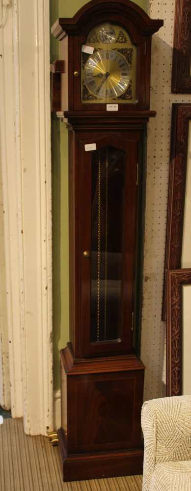 A REPRODUCTION MAHOGANY LONGCASE STYLE CLOCK having glazed single door with display pendulum and