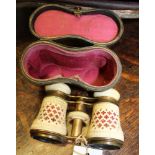 A PAIR OF CASED FANCY FRET CUT OPERA GLASSES