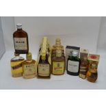 A COLLECTION OF WHISKY MINIATURES to include; Johnnie Walker "Red label", 5cl boxed, Black and White