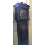 A Jos. Johnson Dudley brass faced long cased oak clock.