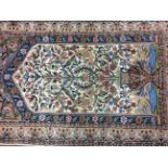 A prayer mat design rug, 195cm x 116cm.