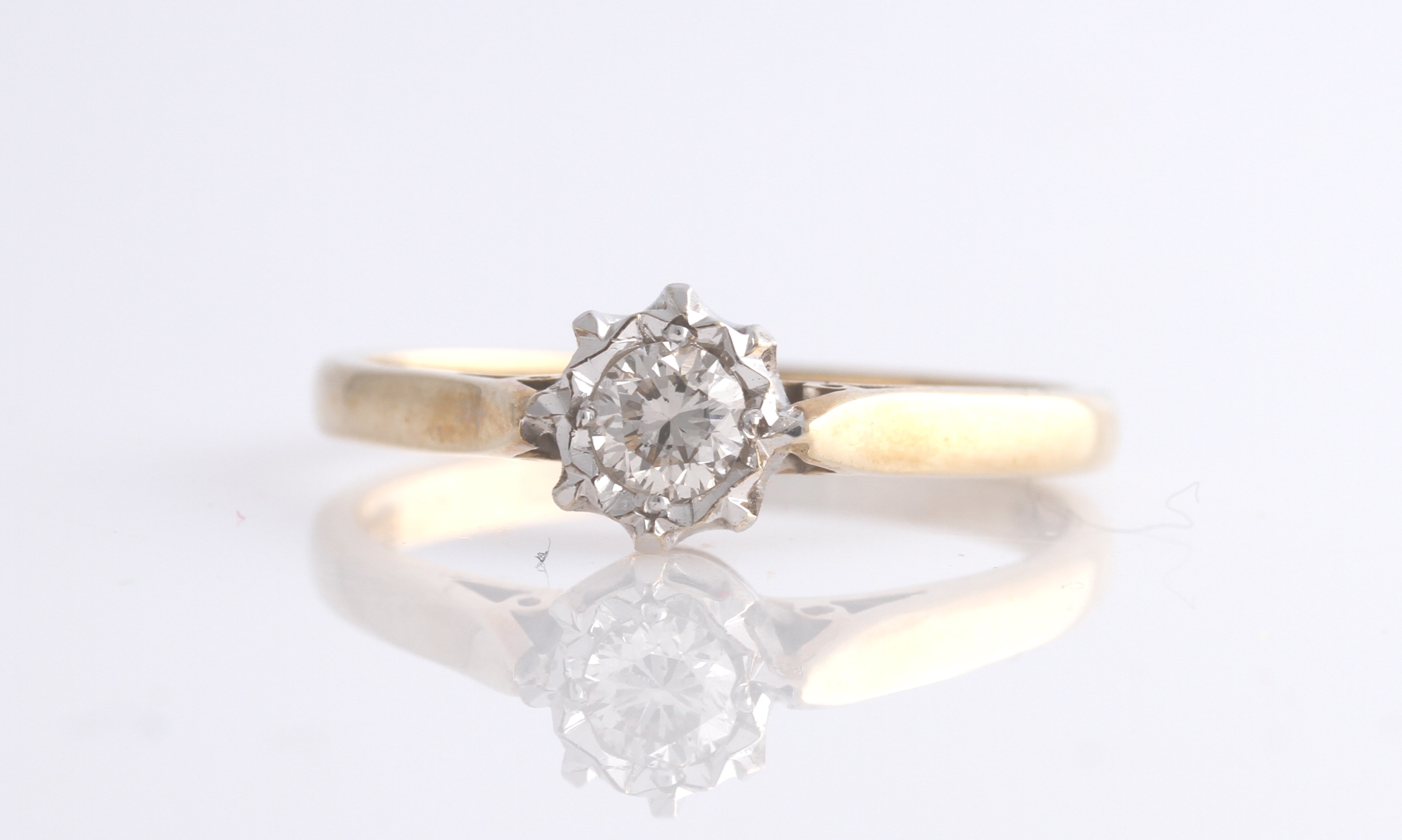 A hallmarked 9ct yellow gold diamond solitaire ring, set with a round brilliant cut diamond,