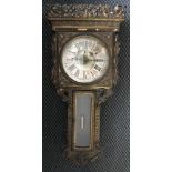 A gilded wood cased wall clock with silver face and Roman numerals.