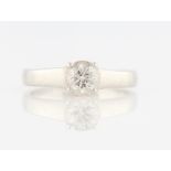 A platinum diamond solitaire ring, set with a round brilliant cut diamond, measuring approx. 0.70ct,