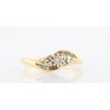 A hallmarked 18ct yellow gold diamond ring, set with one principle diamond, measuring approx. 0.