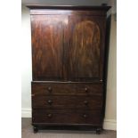 A mahogany two door linen press, fitted with three drawers to base.