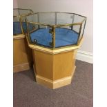 A hexagonal brass trim glazed top display cabinet on beach base. Height 90cm.