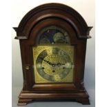 A wooden cased Baldwin astronomical mantel clock. Height 41.5cm.