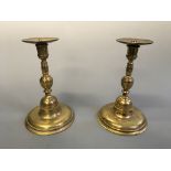 A pair of heavy brass altar candlesticks.