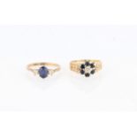 A hallmarked 9ct yellow gold sapphire and diamond flower design ring, with heart design shoulders,