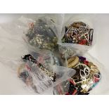 Four bags of costume jewellery.