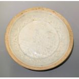 Early Song dynasty celadon saucer with raised fish pattern. Diameter 14cm.
