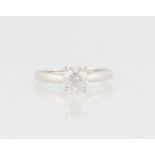 A diamond solitaire ring, set with a round brilliant cut diamond, measuring approx. 1.07ct,