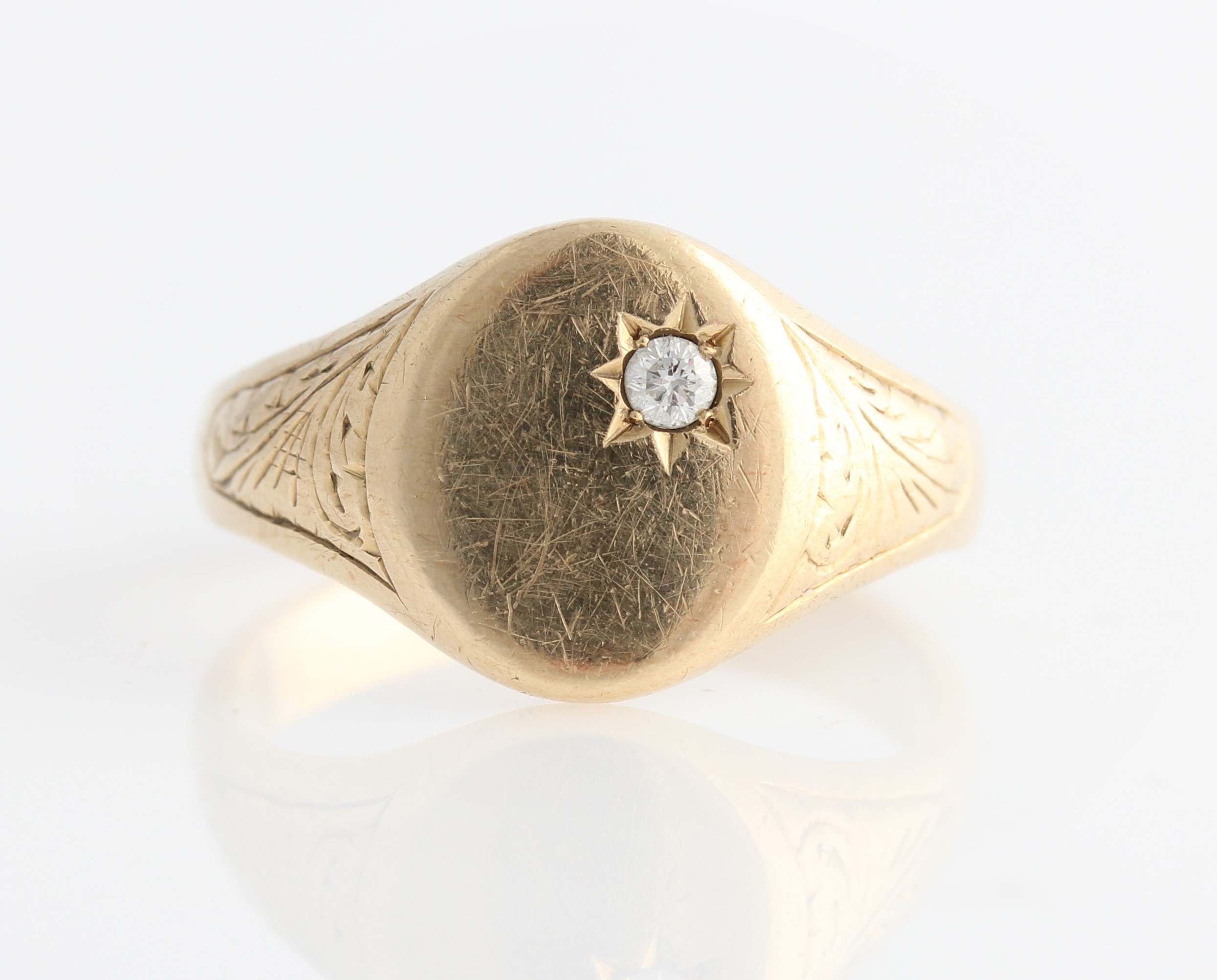 A hallmarked 9ct yellow gold diamond signet ring, set with a round brilliant cut diamond,