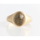 A hallmarked 9ct yellow gold diamond signet ring, set with a round brilliant cut diamond,