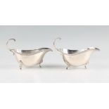 A pair of silver sauce boats, both hallmarked Birmingham 1968, with makers mark B.Ld for Bishton's