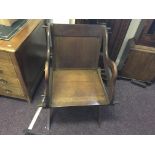 An oak Gothic style armchair with peg joints.