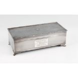 A silver cigarette box, of rectangular form engraved with repeat design to lid and body, lid with