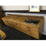 A Uniflex mid-twentieth Century sideboard with marble inlay tile.