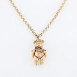 A hallmarked 9ct yellow gold stone set teddy bear pendant, on a hallmarked 9ct yellow gold belcher