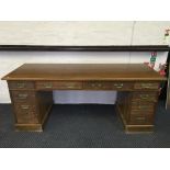 An oak ten drawer desk.