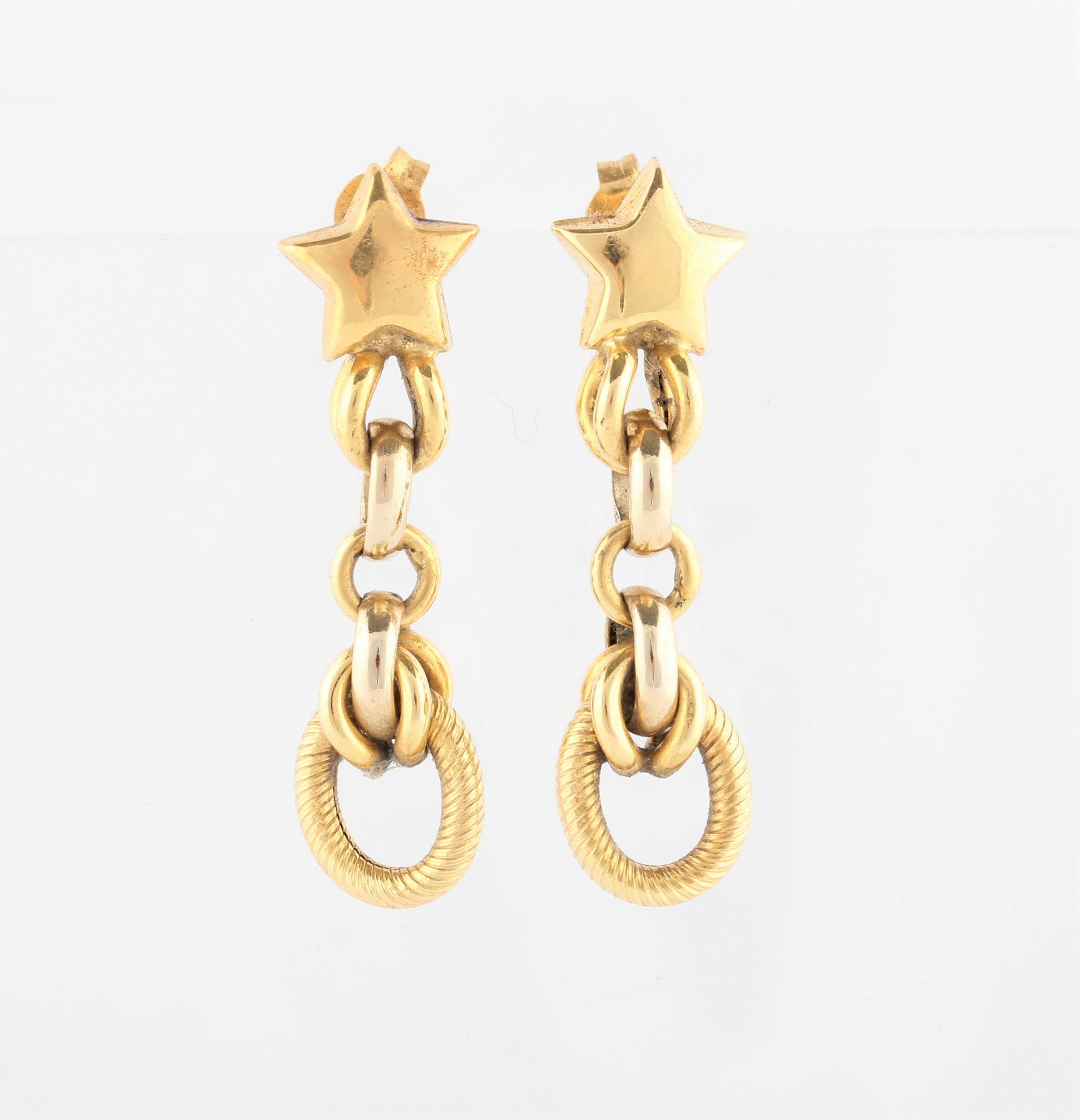 A pair of star and link design drop earrings, stamped 750.