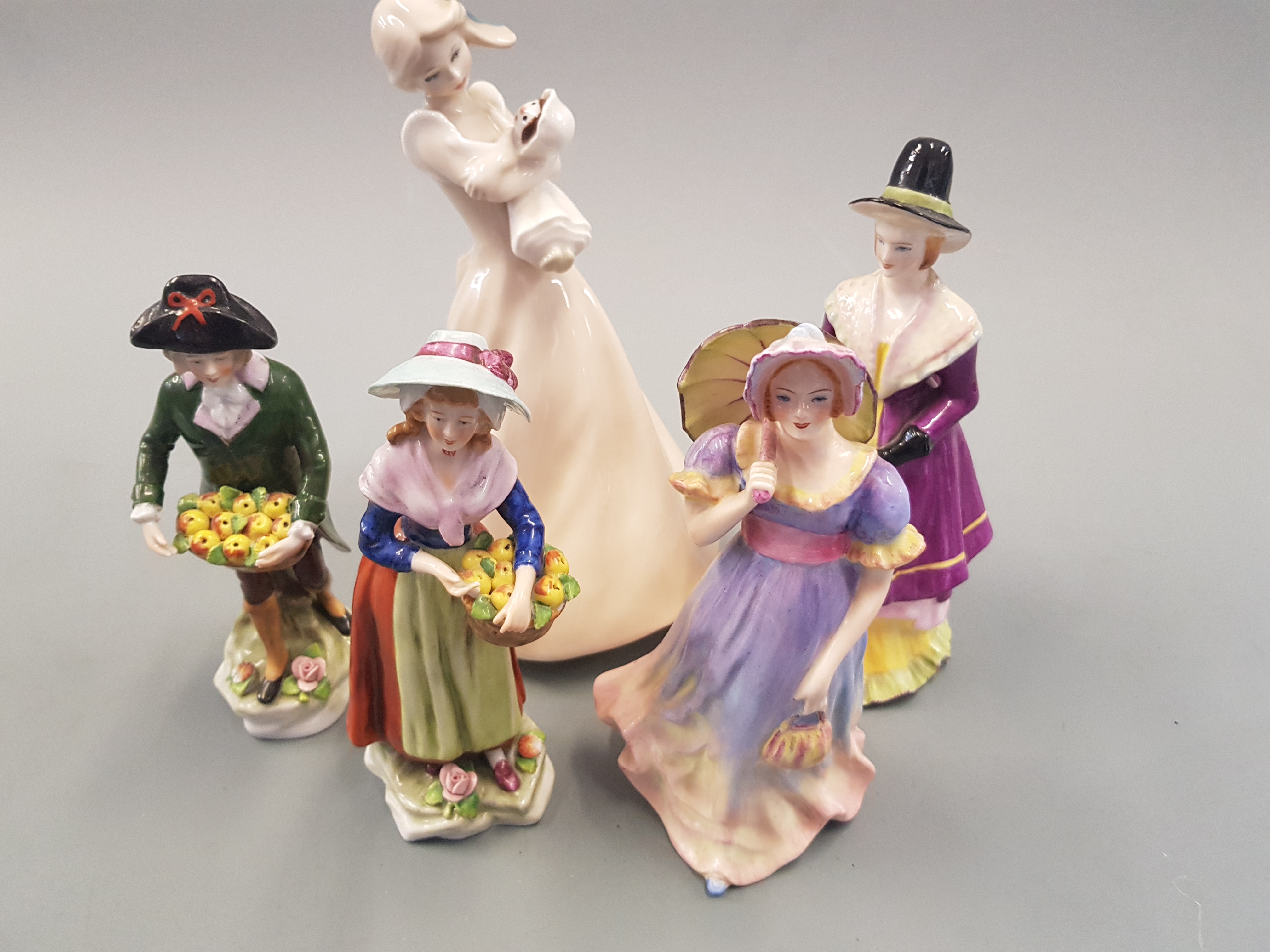 Royal Doulton female figure with four other female figures.