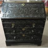 A oak carved front four drawer bureau.