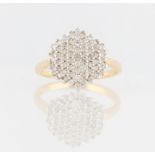 A hallmarked 9ct yellow gold diamond cluster ring, set with approx. 61 round brilliant cut diamonds,