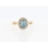 A hallmarked 9ct yellow gold blue topaz and diamond cluster ring, ring size O½.