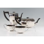 A matched silver Art Deco style tea set, comprising a tea pot, water jug, sugar bowl and milk jug,