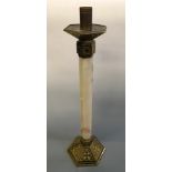 An onyx stem altar candlestick with brass base and top. Height approximately 73cm.