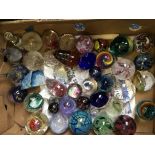 A box of various paperweights.