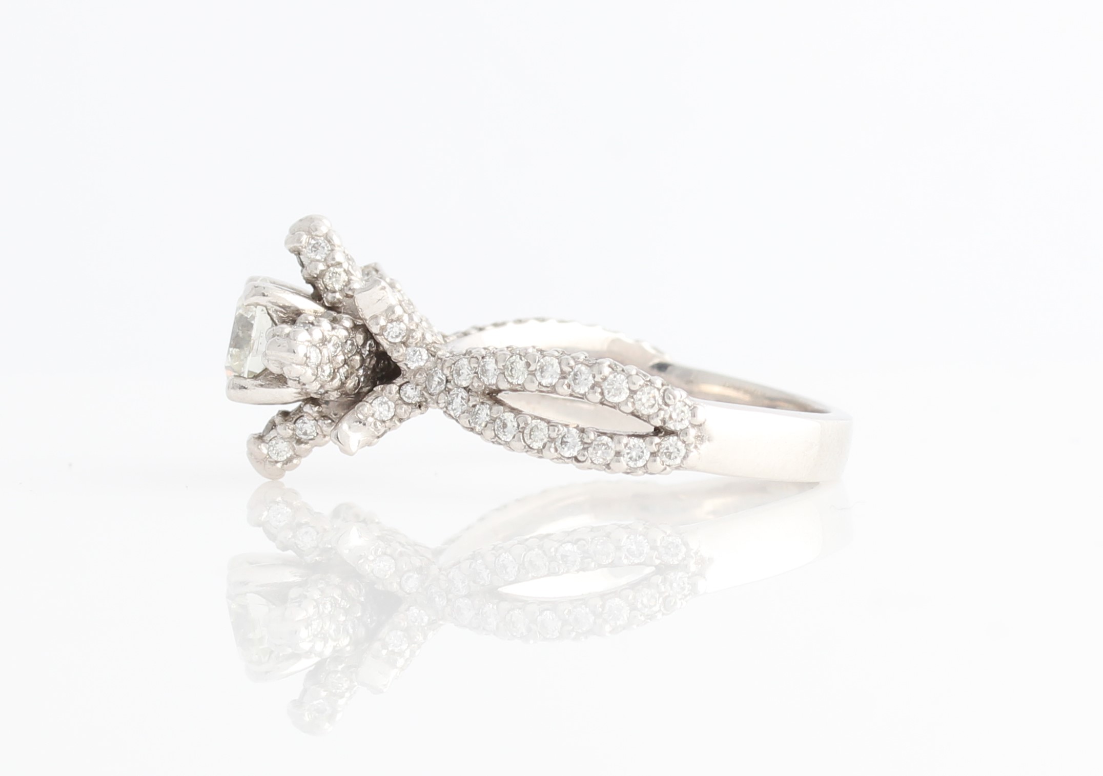 An 18ct white gold diamond ring, of organic design, set centrally with a round brilliant cut - Image 2 of 2