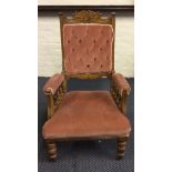 A walnut Edwardian carved back armchair.