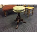 A Victorian oak based swivel piano stool.