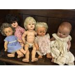 Five various dolls.