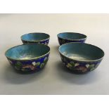 A set of four cloisonné floral design bowls.