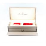 A red Montegrappa fountain pen, in Montegrappa box.