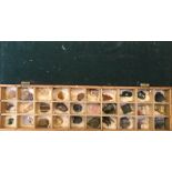 A stone and crystal collection in wooden compartmentalised box, with engineers jig.