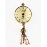 An Omega ball pocket watch clock with tassel.